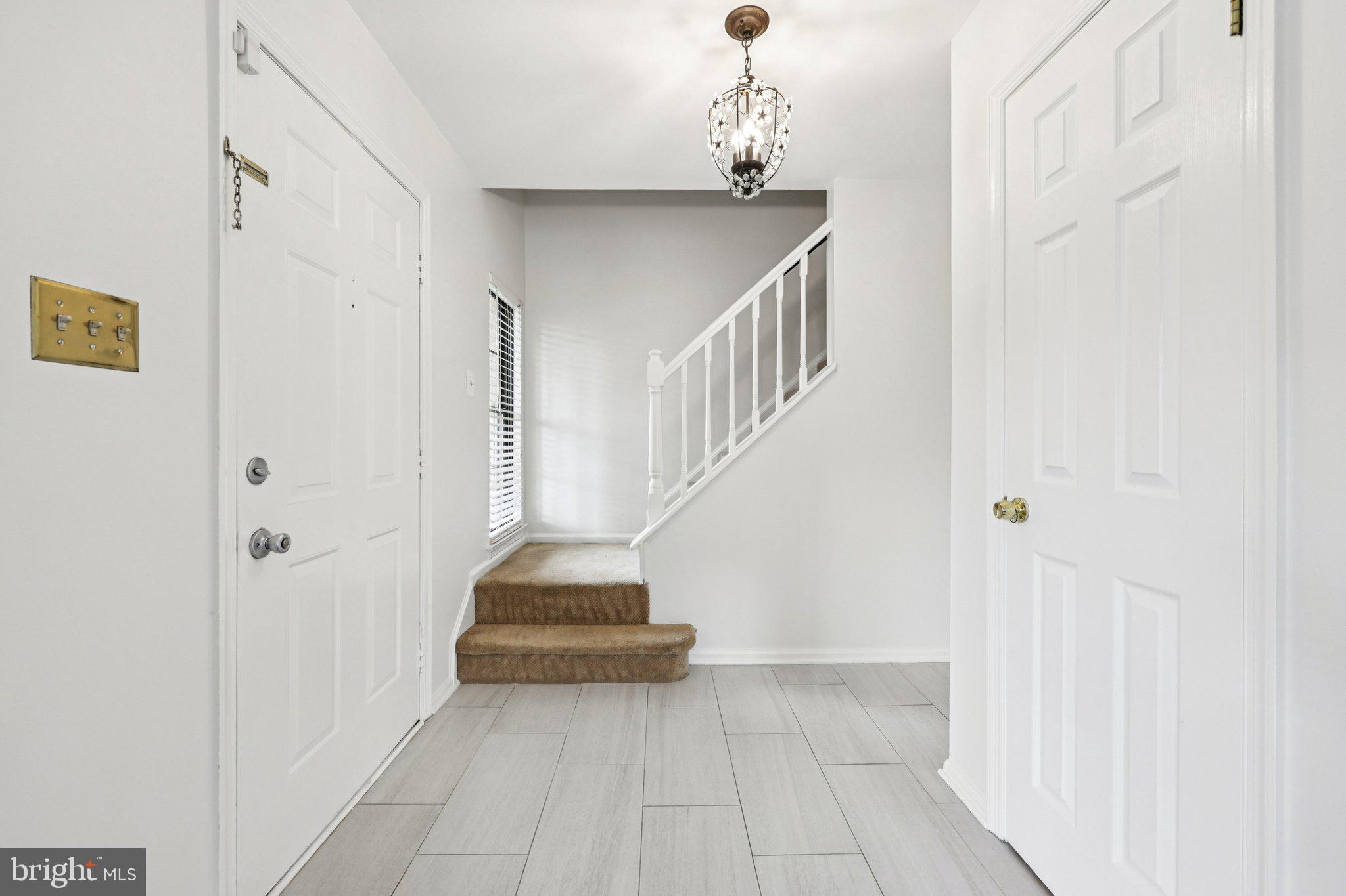 2 Berkeley Court Sterling, VA 20165 - Photo 6 of 46 a view of entryway and hall with a front door