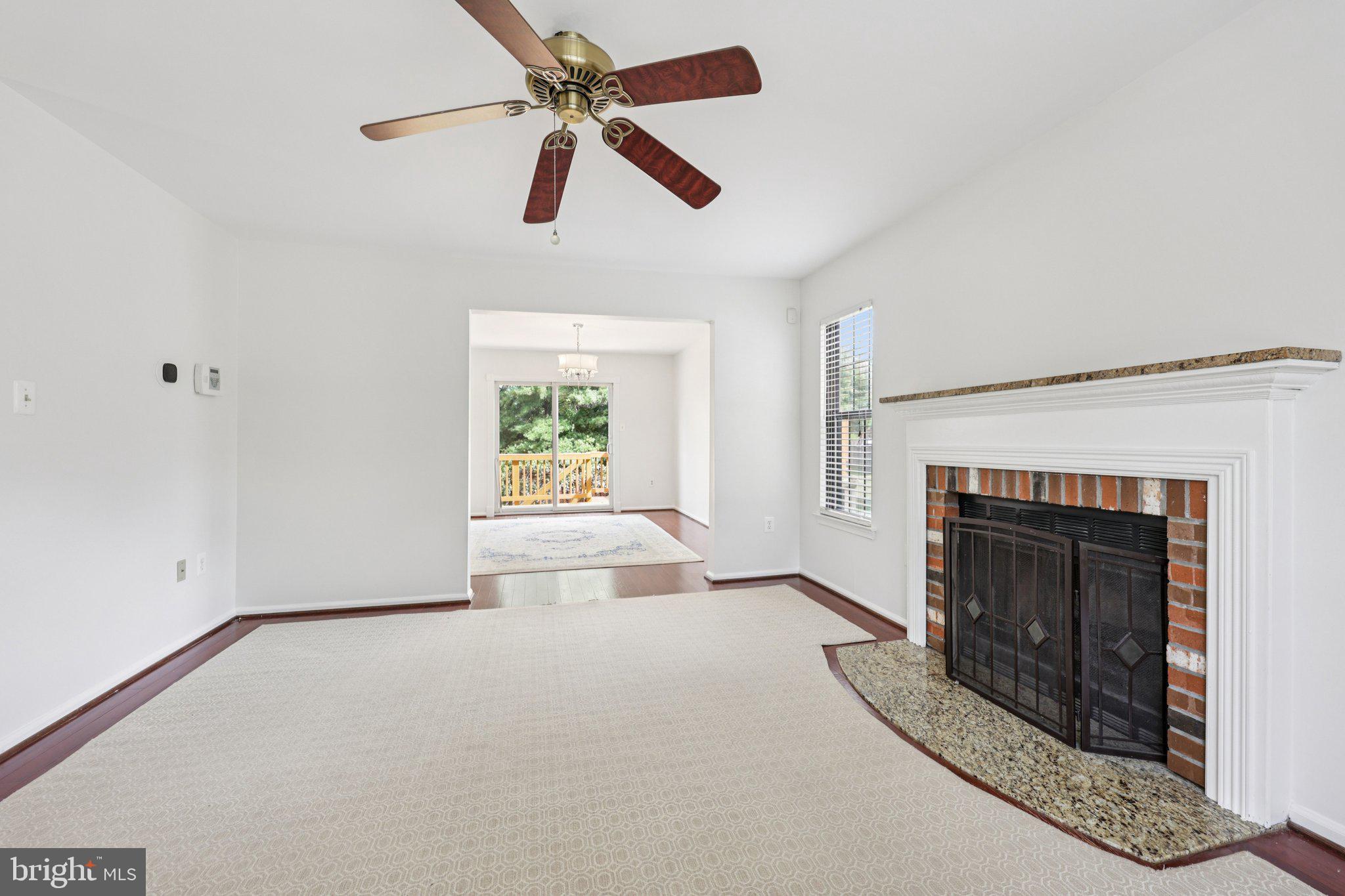 2 Berkeley Court Sterling, VA 20165 - Photo 8 of 46 an empty room with windows and fireplace