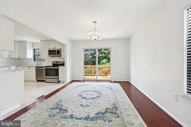 a view of a kitchen with a sink and a window