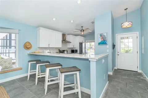 a kitchen with a table and chairs in it