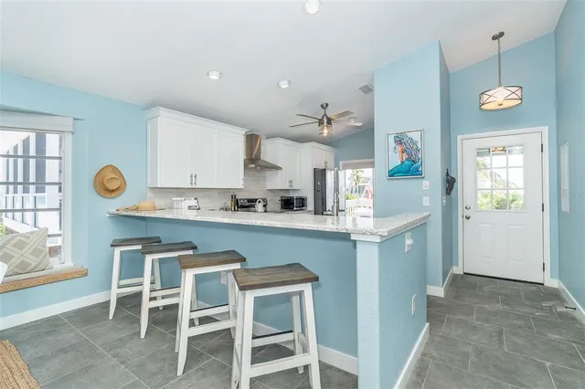 a kitchen with a table and chairs in it