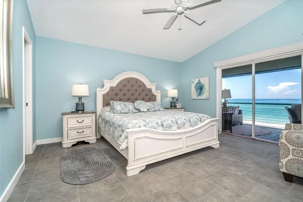 a bed room with a bed and a chair