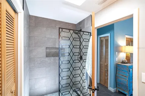 a bathroom with a shower and a sink