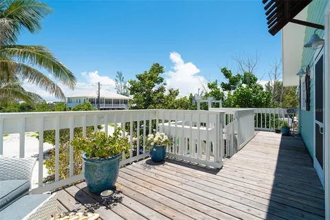a view of balcony with furniture