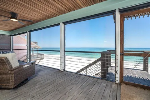 a view of balcony with couch and wooden floor