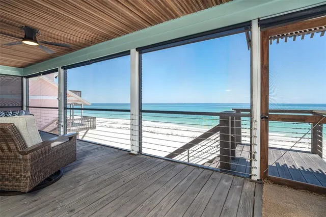 a view of balcony with couch and wooden floor