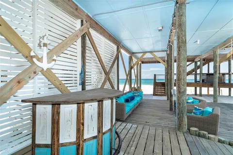 a view of balcony with wooden floor