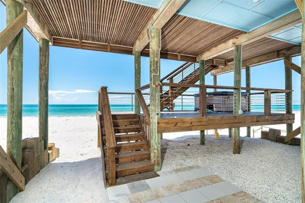 a front view of a house with large windows