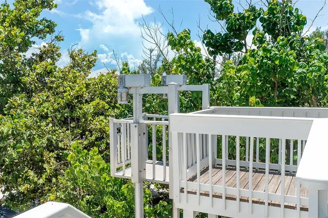 a view of a house with a small yard and plants