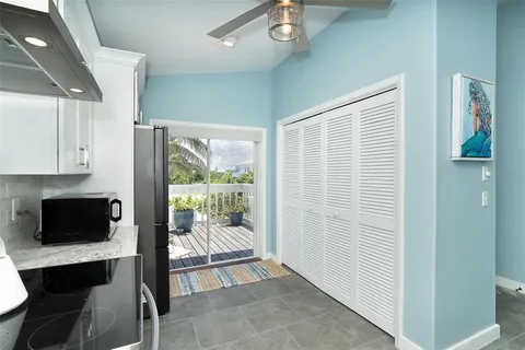 a view of a livingroom with furniture and a window