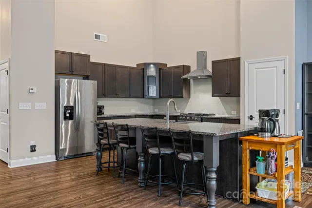 a spacious bedroom with a bed and a window