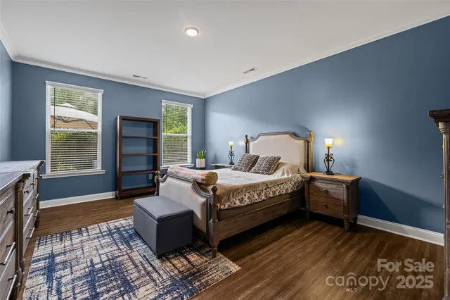 a view of a patio with table and chairs under an umbrella