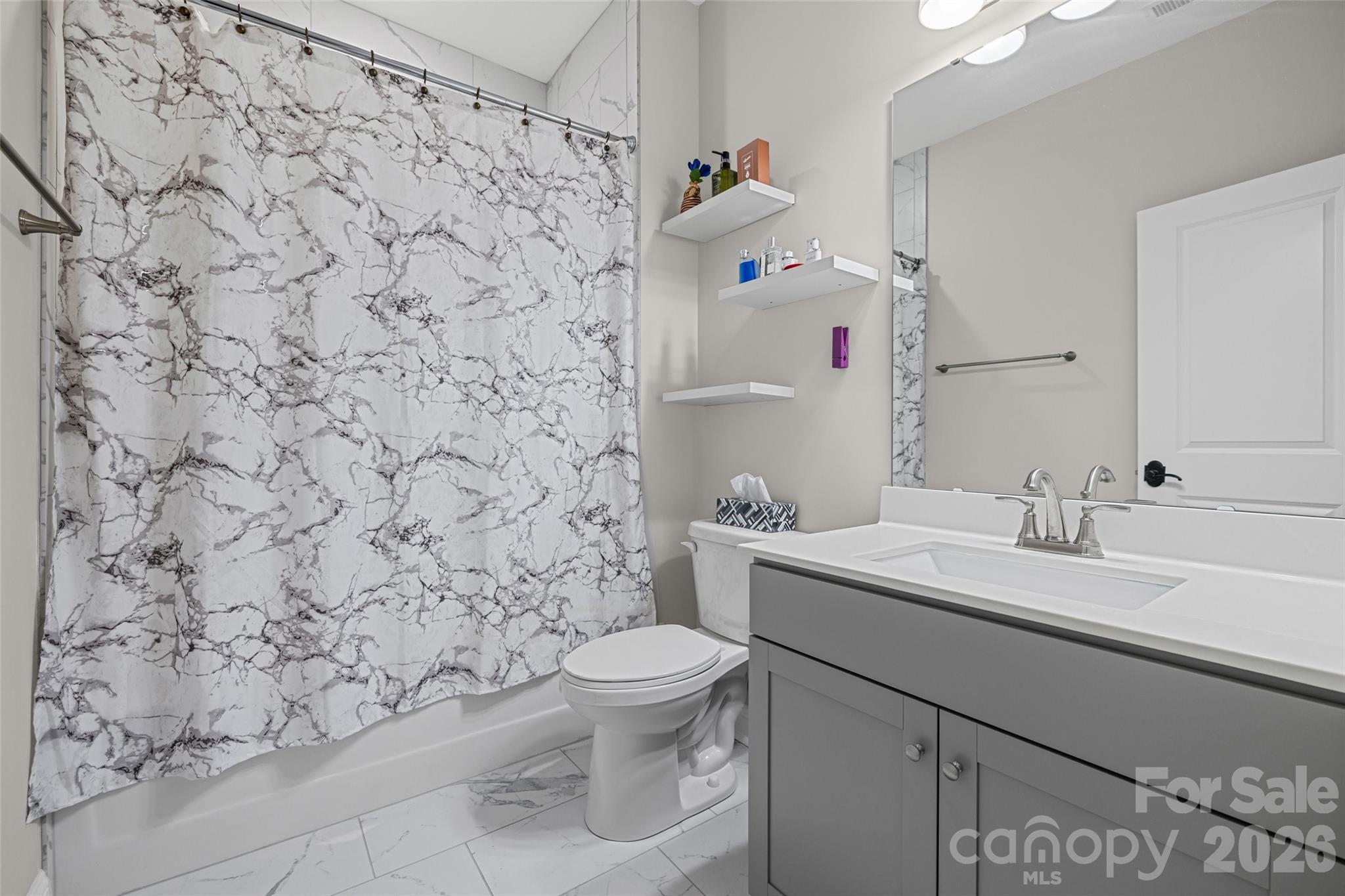 1321 Fishing Creek Road Clover, SC 29710 - Photo 36 of 47 a bathroom with a sink toilet and a mirror