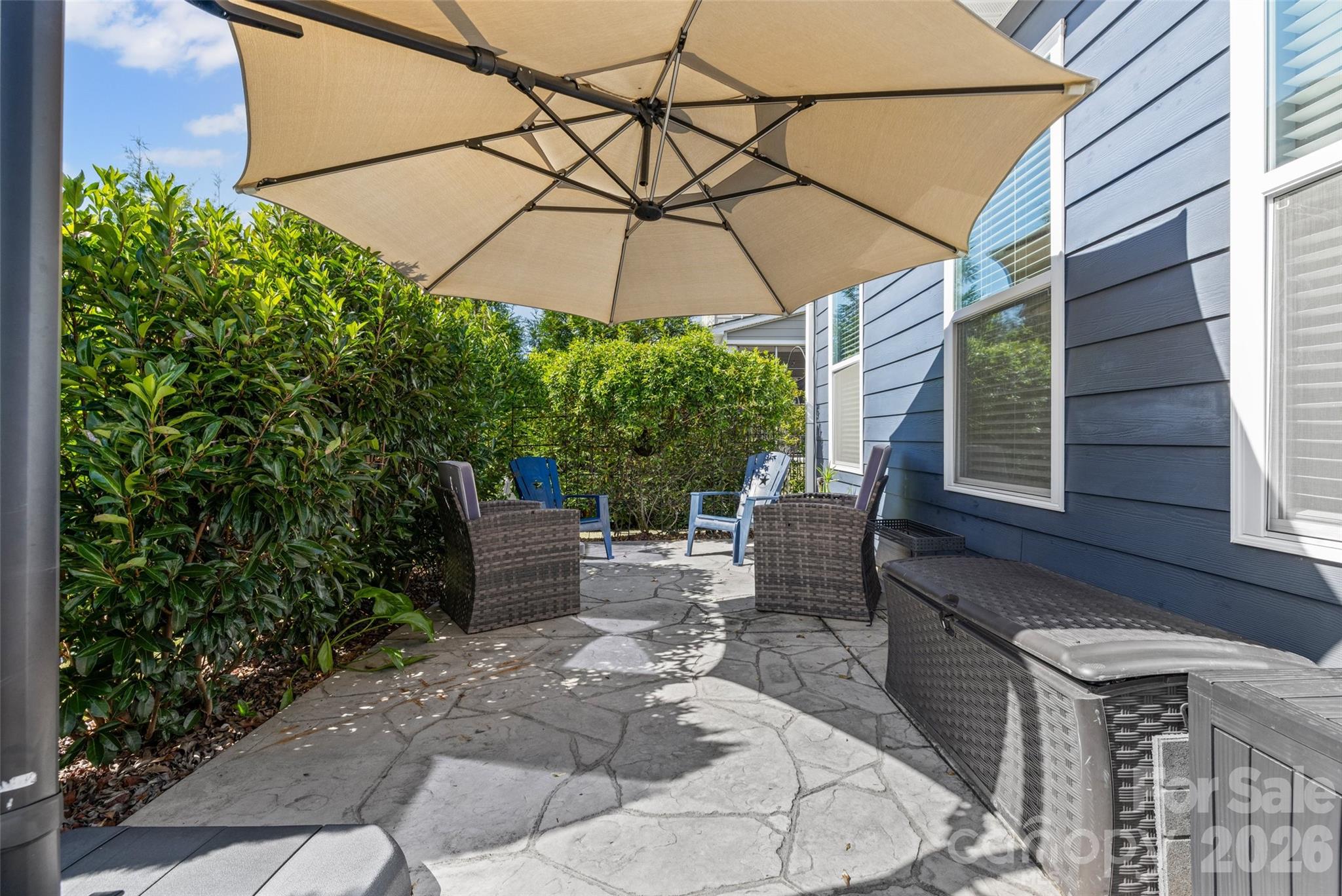 1321 Fishing Creek Road Clover, SC 29710 - Photo 39 of 47 a view of a patio with table and chairs under an umbrella