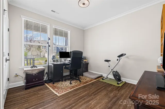 a living room with fireplace furniture and a flat screen tv