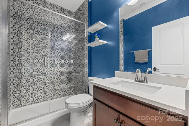 a living room with furniture fireplace and flat screen tv