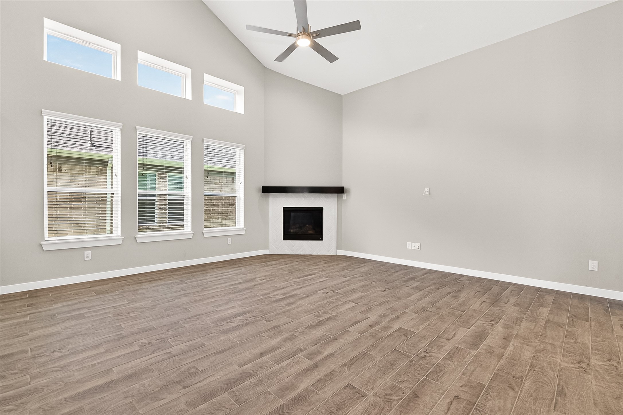 2142 Reed Cave Lane Spring, TX 77386 - Photo 13 of 50 a view of an empty room with wooden floor and a window