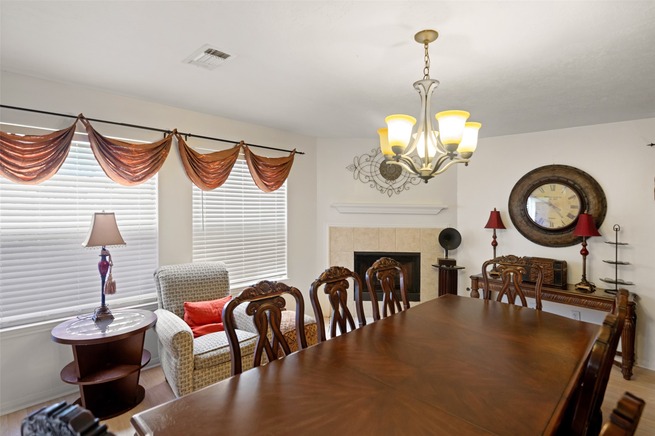 2514 Raintree Village Drive Katy, TX 77449 - Photo 11 of 26 a view of a dining room with furniture a chandelier and wooden floor