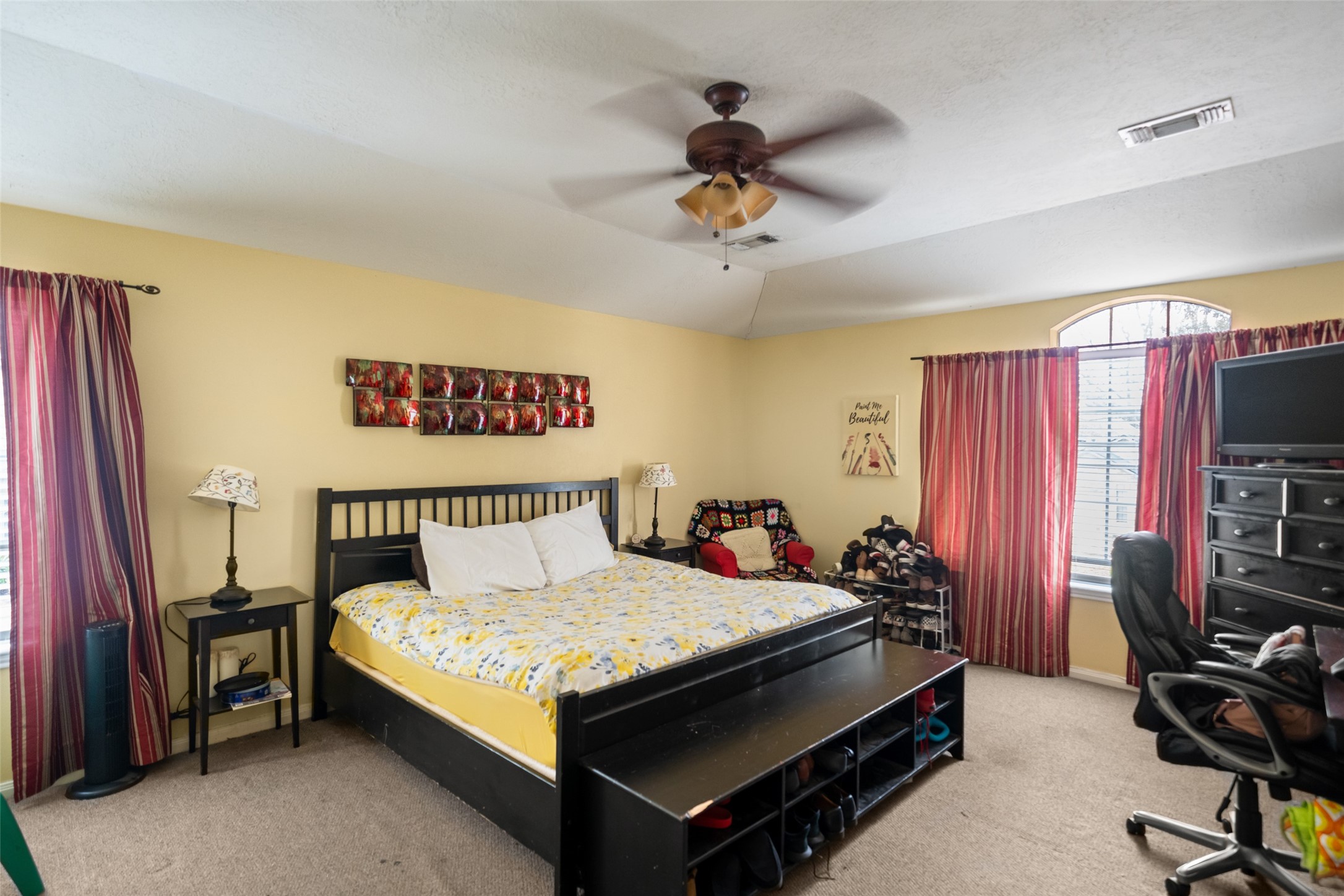 2514 Raintree Village Drive Katy, TX 77449 - Photo 15 of 26 a bedroom with a bed and a flat screen tv