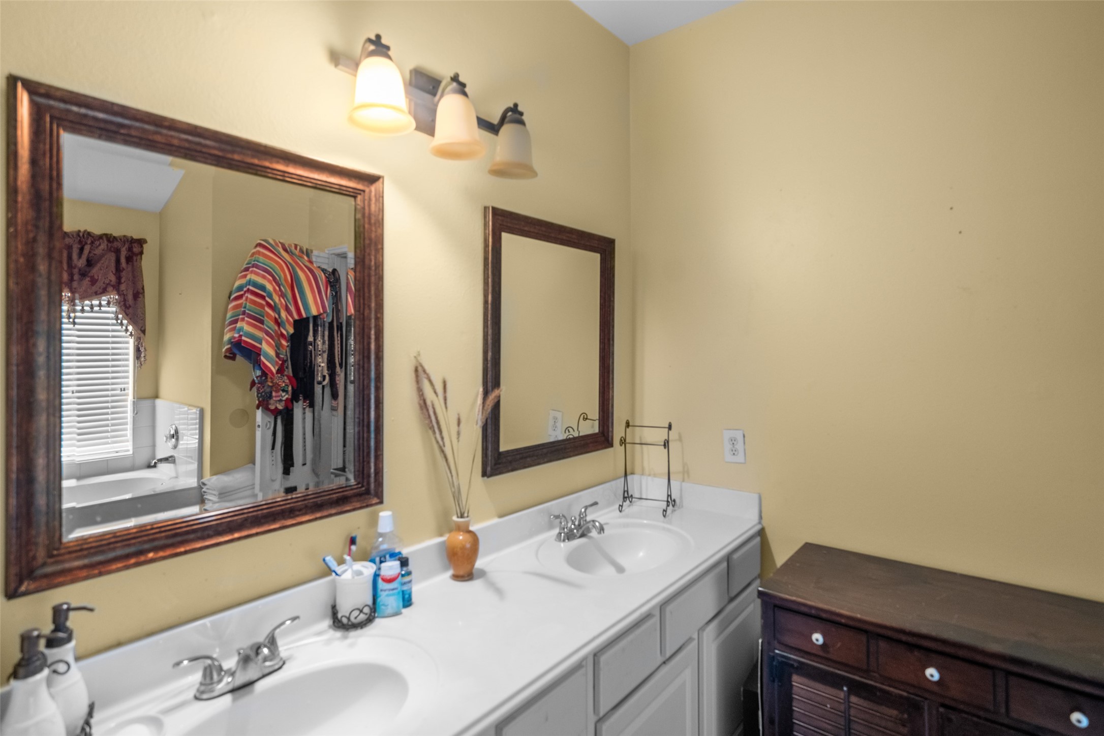 2514 Raintree Village Drive Katy, TX 77449 - Photo 17 of 26 a bathroom with a sink and a mirror