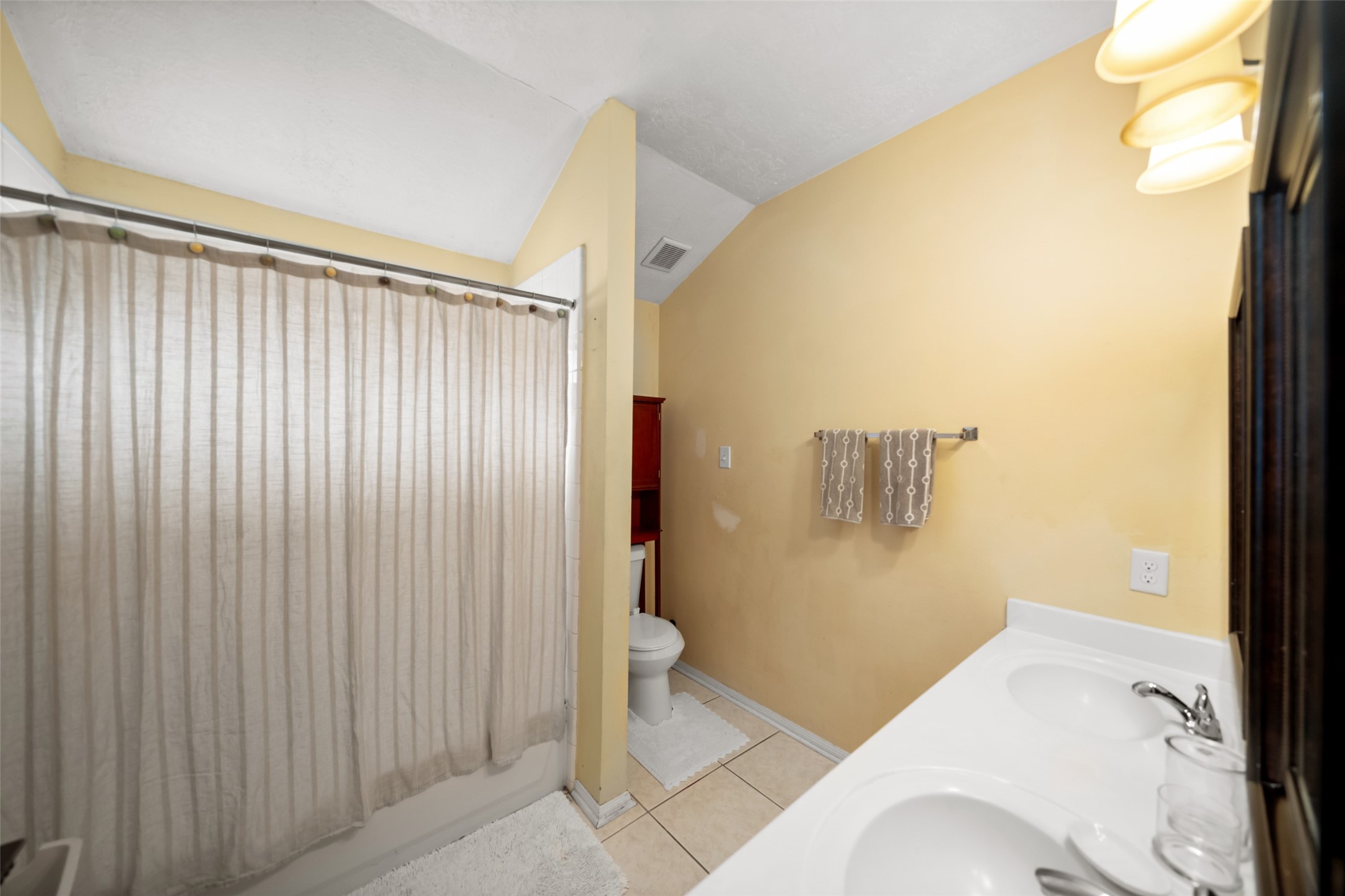 2514 Raintree Village Drive Katy, TX 77449 - Photo 22 of 26 a bathroom with a sink and toilet