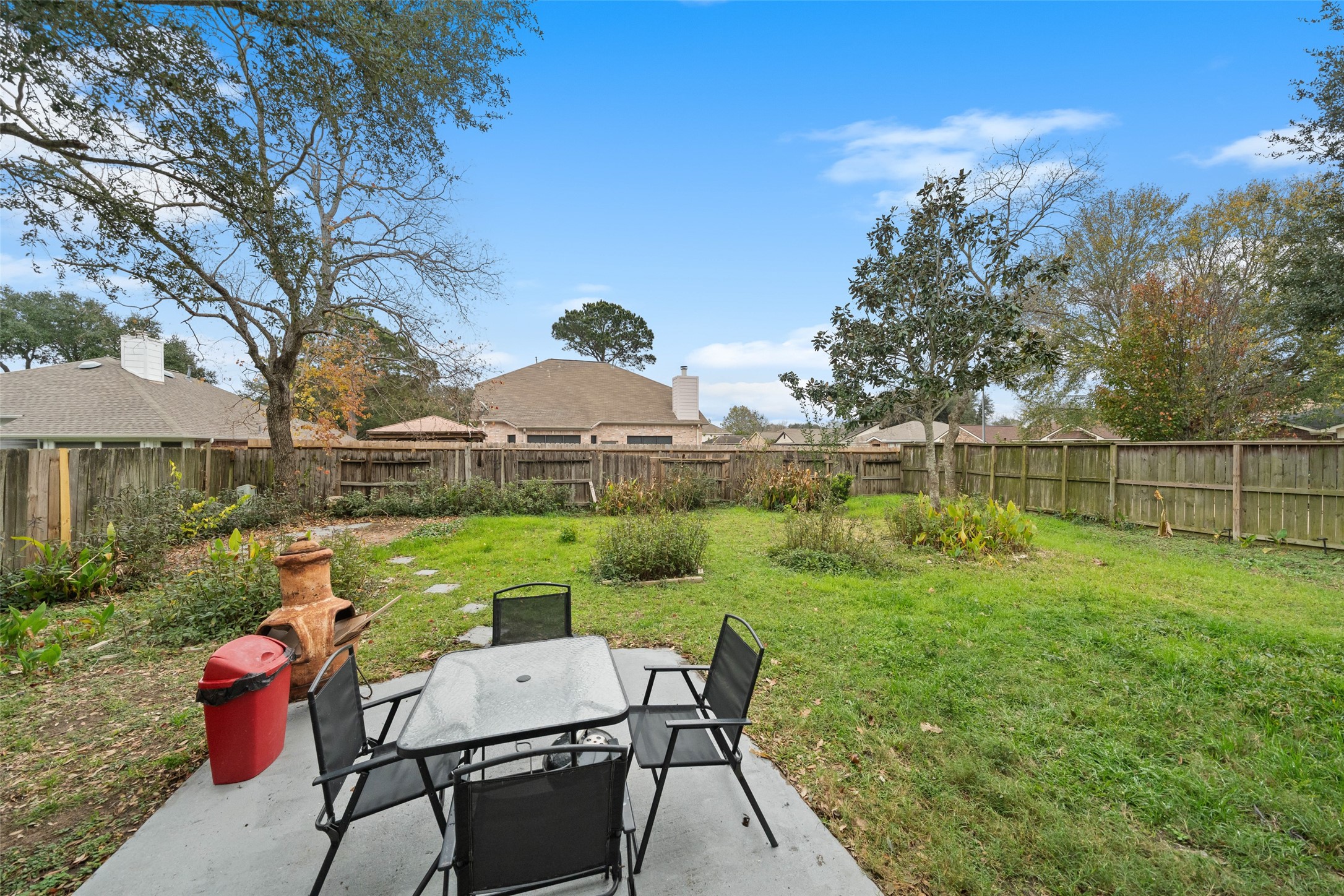 2514 Raintree Village Drive Katy, TX 77449 - Photo 24 of 26 a view of a house with backyard and sitting area
