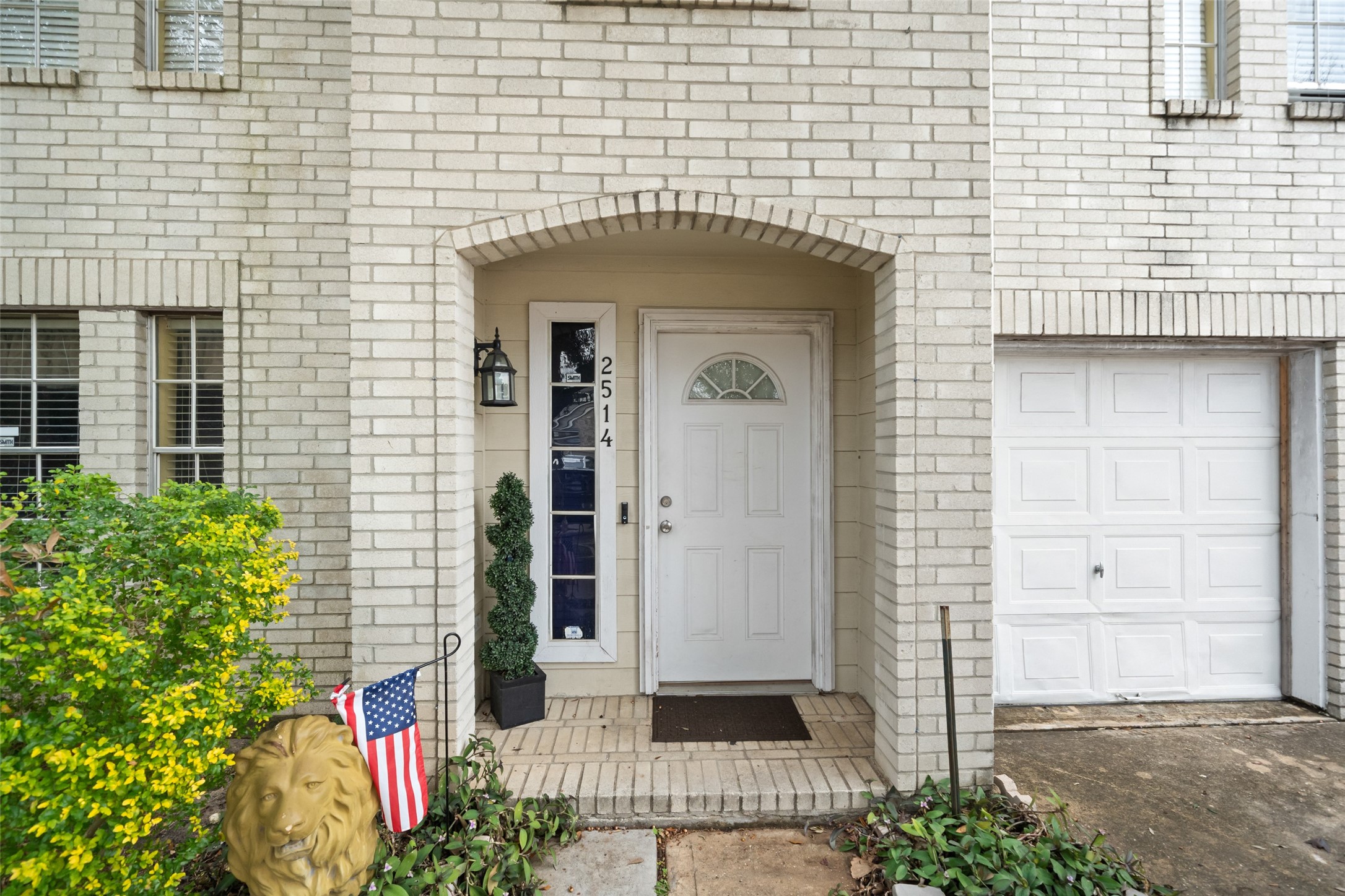 2514 Raintree Village Drive Katy, TX 77449 - Photo 7 of 26 a front view of a house with a garden