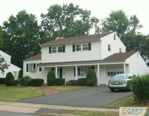 8 Grier Road Somerset, NJ 08873 - Photo 1 of 7 a front view of a house with a garden
