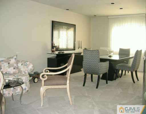 8 Grier Road Somerset, NJ 08873 - Photo 3 of 7 a view of a dining room with furniture and a window