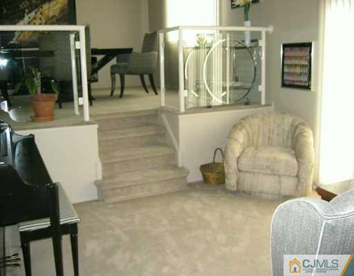 8 Grier Road Somerset, NJ 08873 - Photo 4 of 7 a living room with furniture and a rug