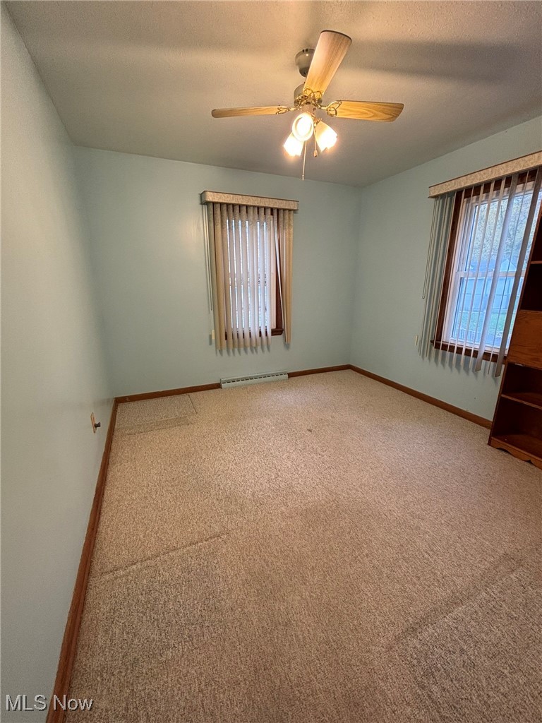 1039 Center Road Eastlake, OH 44095 - Photo 16 of 29 Second bedroom featuring 2 windows and hardwood floors underneath carpet.