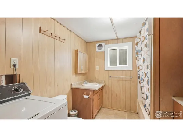 a bathroom with a sink a mirror and a shower