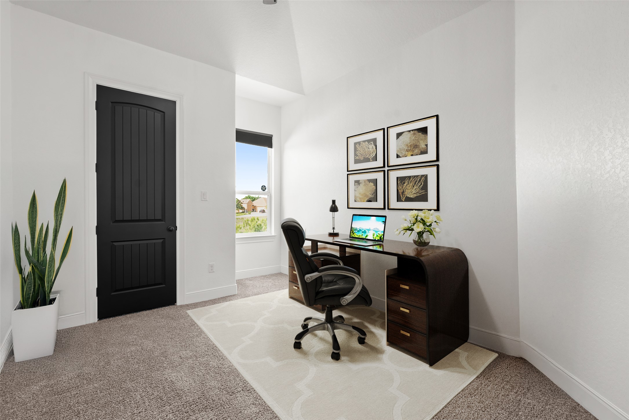 128 Hiram Cook Blanco, TX 78606 - Photo 22 of 40 Versatile space that could be used as a second bedroom or office! Carpeted room with a black paneled door, a single window, and white walls