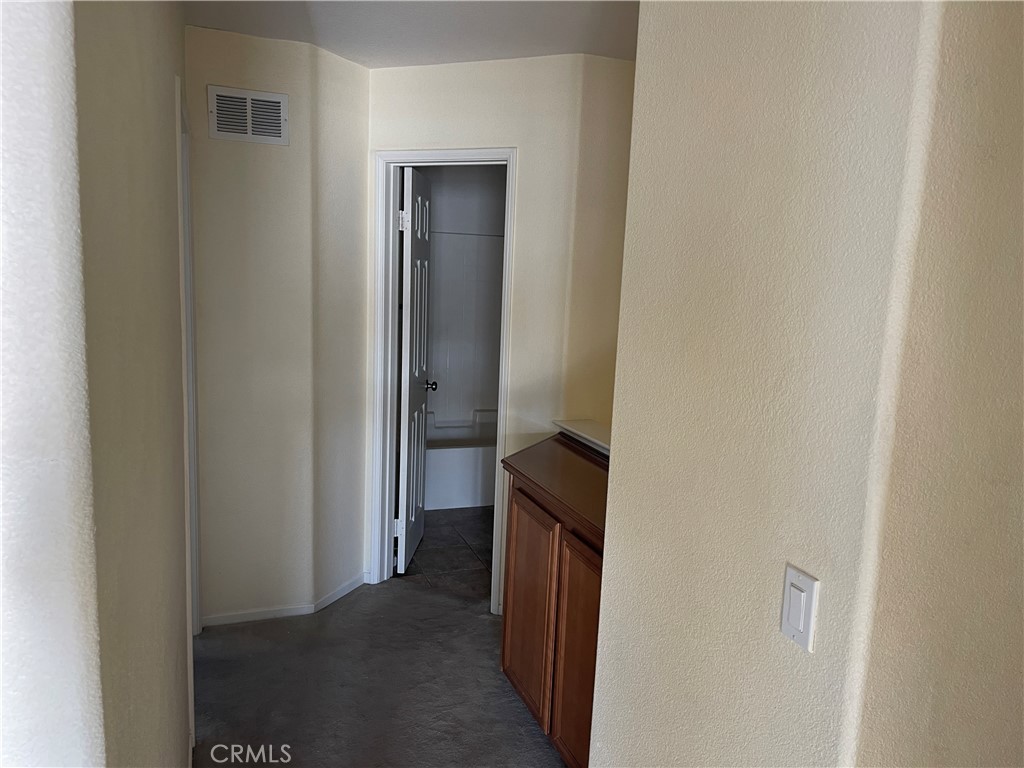 25248 Meadow Walk Street, Unit 1 Murrieta, CA 92562 - Photo 11 of 18 a view of a bathroom from a hallway
