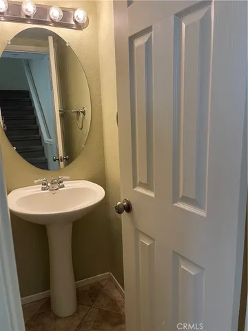 a bathroom with a sink a mirror and vanity