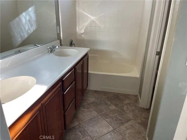 a bathroom with a sink a vanity and a mirror