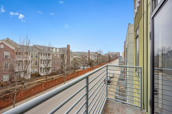 a bathroom with a granite countertop shower a toilet and a sink