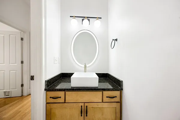 a view of a kitchen with a sink and a window