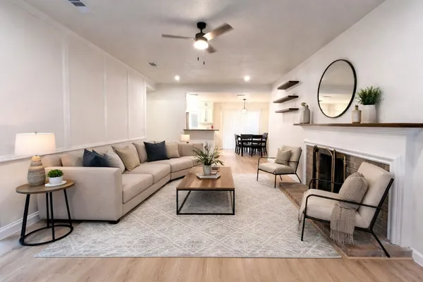 a front view of a house with a garden and yard