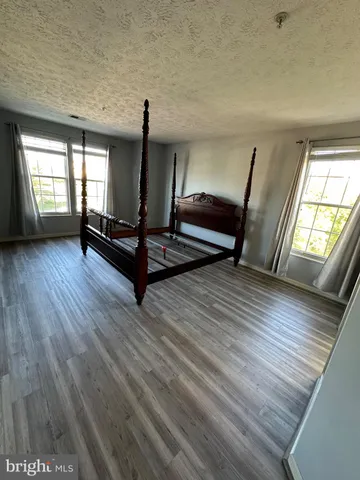 a living room with furniture and windows