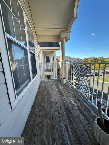 a view of balcony with wooden floor