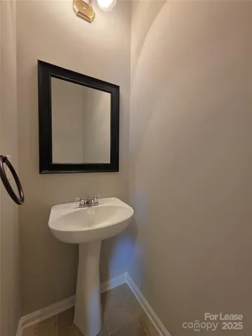 a bathroom with a sink and mirror