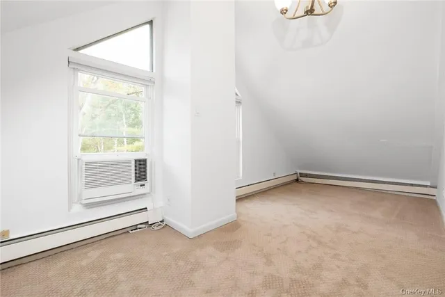 an empty room with a empty space and window