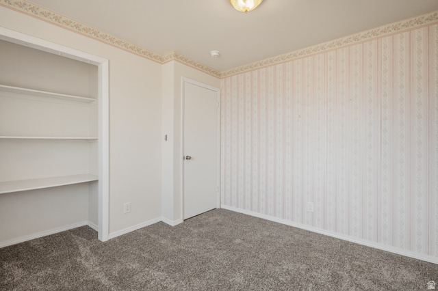 337 North Main Street Central Valley, UT 84754 - Photo 26 of 40 Unfurnished bedroom featuring dark carpet and a closet