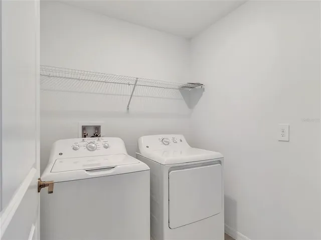 a utility room with dryer and washer