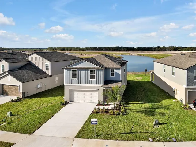 a aerial view of a house with a yard