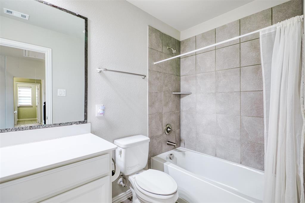 2317 Connor Way Carrollton, TX 75010 - Photo 32 of 37 a bathroom with a toilet sink and shower