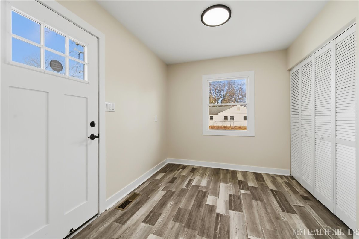 1401 Seminole Drive Ottawa, IL 61350 - Photo 11 of 24 a view of a hallway with wooden floor and a bathroom