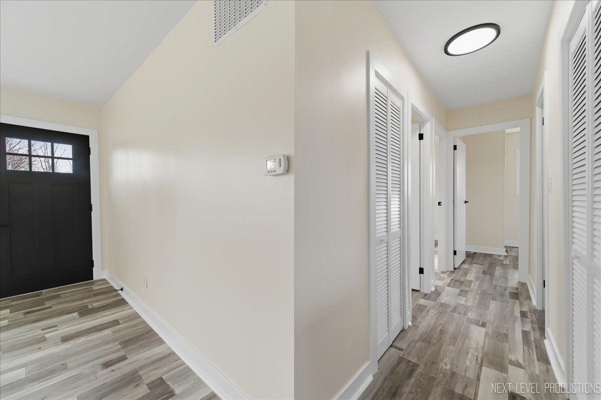 1401 Seminole Drive Ottawa, IL 61350 - Photo 19 of 24 a view of a room with wooden floor and bathroom