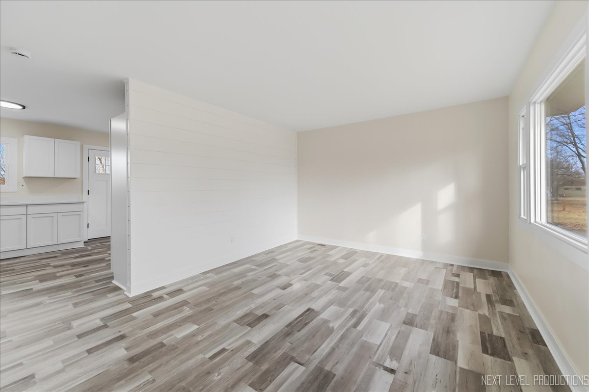 1401 Seminole Drive Ottawa, IL 61350 - Photo 8 of 24 a view of empty room with wooden floor and fan